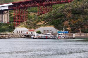 Marin, CA, 2016 - Two Coast Guard Motor Lifeboats At Dock Below Golden Gate Bridge photo