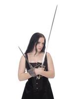 Young woman with sword and dagger in corset and skirt photo
