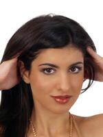 Young middle eastern woman portrait with hands in hair photo