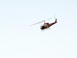 Folsom, CA, 2009 - Red and white fire department helicopter blue sky photo