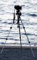 Newport, OR, 2012 - Camera Mounted On Tripod Pointing Out At Water photo