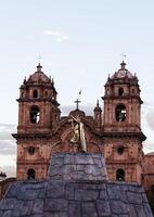 Cusco, Peru, 2015 - Inca King Statue In Plaza With Church South America photo