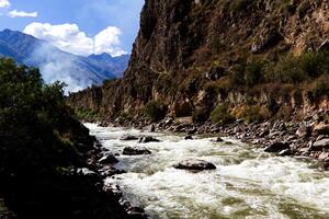 Urubamba River In Peru South America With Smoke And Clouds photo