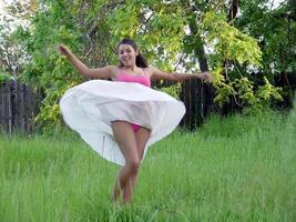 Caucasian Woman Skirt Flying Green Grass Outdoors photo