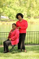 two older black women outdoors at park photo