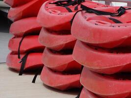 Folsom, CA, 2003 - Red Plastic Kayaks Stacked On Dock For Rental photo