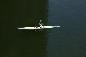 Folsom, CA, 2010 - Green and yellow kayak on water from above photo