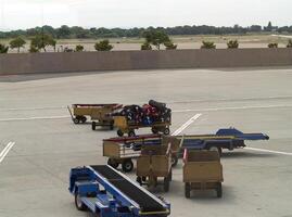 Sacramento, CA, 2007 - Airport Luggage Transport Equipment Sitting Idle Some Loaded photo