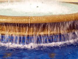 Palo Alto, CA, 2006 - Water splashing and overflowing in fountain photo