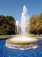 Palo Alto, CA, 2006 - Fountain spraying up with pool of water photo