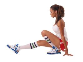 Young black woman stretching out in shorts photo