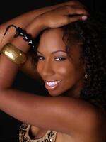 Young black woman portrait with hands on head photo