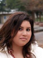 Plus-sized hispanic woman outdoor portrait overcast day photo