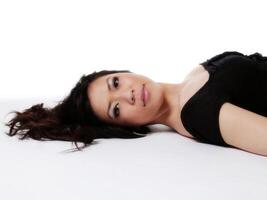 Reclining Portrait Of Beautiful Asian American Woman photo