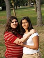 two sisters in outdoor portrait at park photo