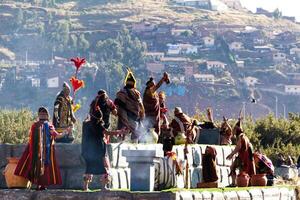 Cusco, Peru, 2015 - Man Holding Up Lama Heart Inti Raymi Festival photo