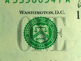 Close-up Detail Of United States One Dollar Bill Treasury Seal photo