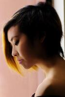 Profile Portrait Asian American Woman Window Light photo