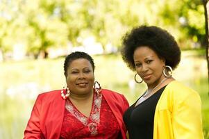 Two Middle Aged African American Women Outdoor Portrait photo