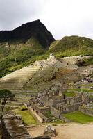 Machu Picchu, Peru, 2015 - Distant View Of Tourists Exploring South America photo