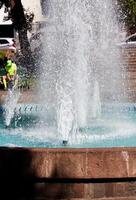 Cusco, Peru, 2015 - Plaza Fountain Spraying Water Streams Up Into The Air South America photo