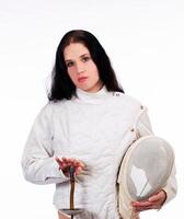 Caucasian Woman In Fencing Jacket Holding Mask And Top Of Foil photo
