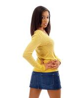 Young black woman in jeans skirt from behind photo