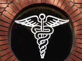 White outline medical symbol in round window photo