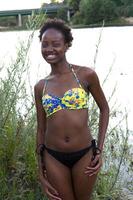 Young African American Teen Woman Swim Suit At River photo