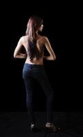 Topless Skinny Hispanic Woman Back Towards Camera photo