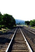 Empty Railroad Tracks Leading To Turn photo