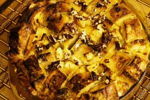 French Bread Casserole In Round Dish On Place Mat photo