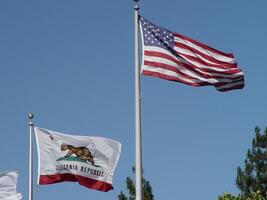 United States And California State Flag Blue sky photo