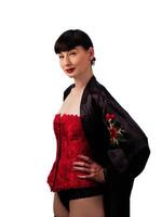 Caucasian Woman In Red Corset And Black Robe photo