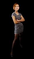 Skinny Asian American Woman Arms Crossed In Knit Dress photo