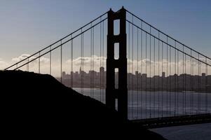 Silhouette North Tower Golden Gate Bridge With City photo