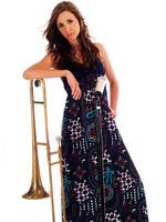 Caucasian Teen In Long Dress Leaning On Trombone photo