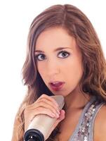 Young Caucasian Teen Girl Holding Microphone photo