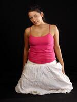 Young Caucasian Woman in Skirt And Pink Top photo