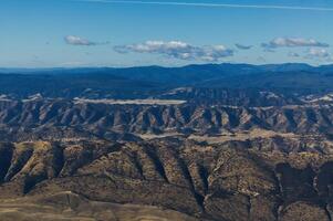 Aerial View Of Foothills And Mountains From Glider photo
