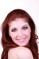 Smiling portrait young red head woman bare shoulder photo