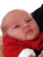 Closeup of Infant Girl in Red Suit photo