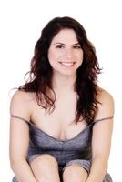 Smiling Brunette Caucasian Woman Sitting Showing Cleavage photo