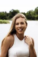 Outdoor Portrait Caucasian Teen Smiling At River photo