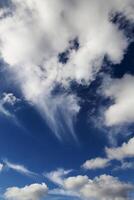 White Cumulus Clouds In Blue Sky From Airplane photo