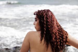 Latina Woman Bare Back Profile Portrait Ocean photo