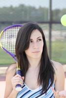 Young hispanic teen girl tennis racket and ball photo