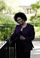 Middle Aged African American Woman Outdoors Park Smiling photo