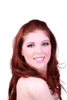 Smiling portrait of 20-something redhead woman bare shoulders photo