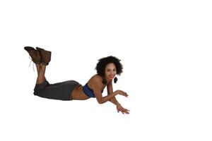 Slim Smiling African American Woman Laying On Stomach Gray Pants photo